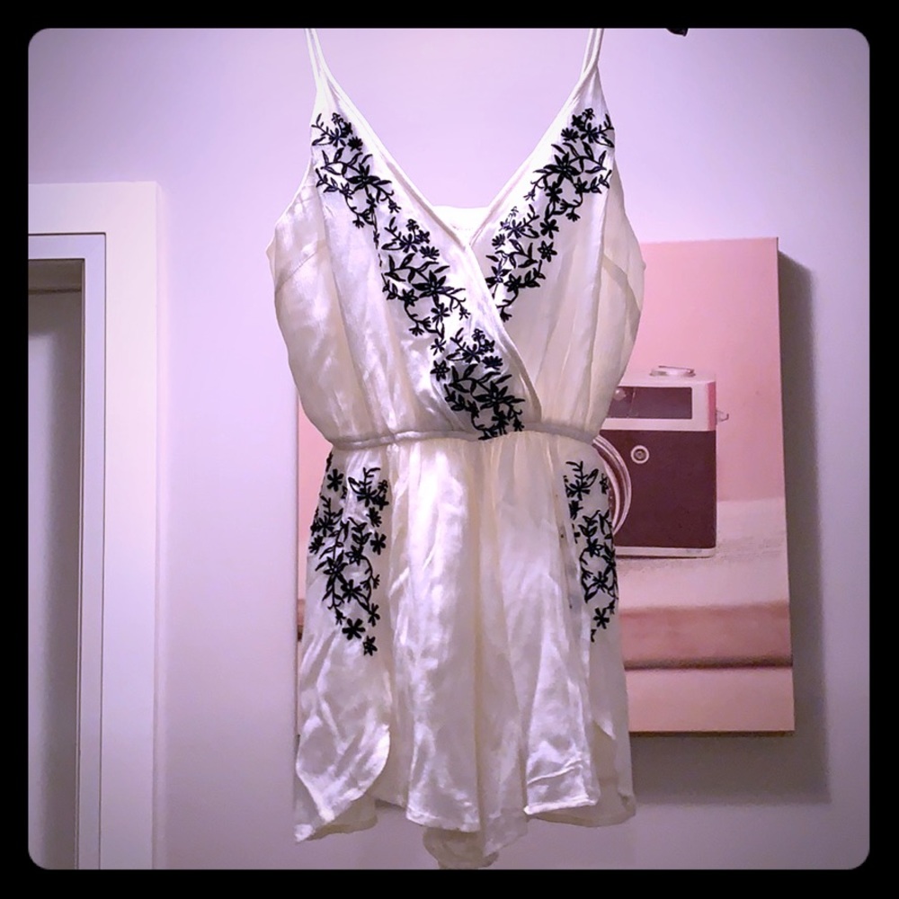 White V-Neck Embroidered Romper with Black Floral Detail